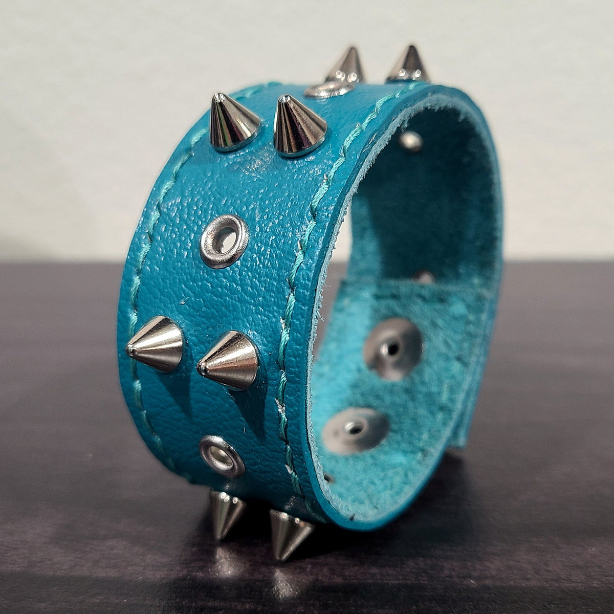 Dark Teal Leather Bracelet with Silver Cones